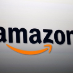 SANTA MONICA, CA - SEPTEMBER 6: The Amazon logo is projected onto a screen at a press conference on September 6, 2012 in Santa Monica, California. Amazon unveiled the Kindle Paperwhite and the Kindle Fire HD in 7 and 8.9-inch sizes. (Photo by David McNew/Getty Images)